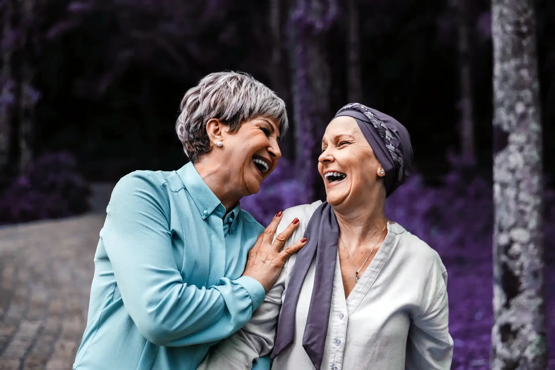 One woman with turban smiling with girlfriend