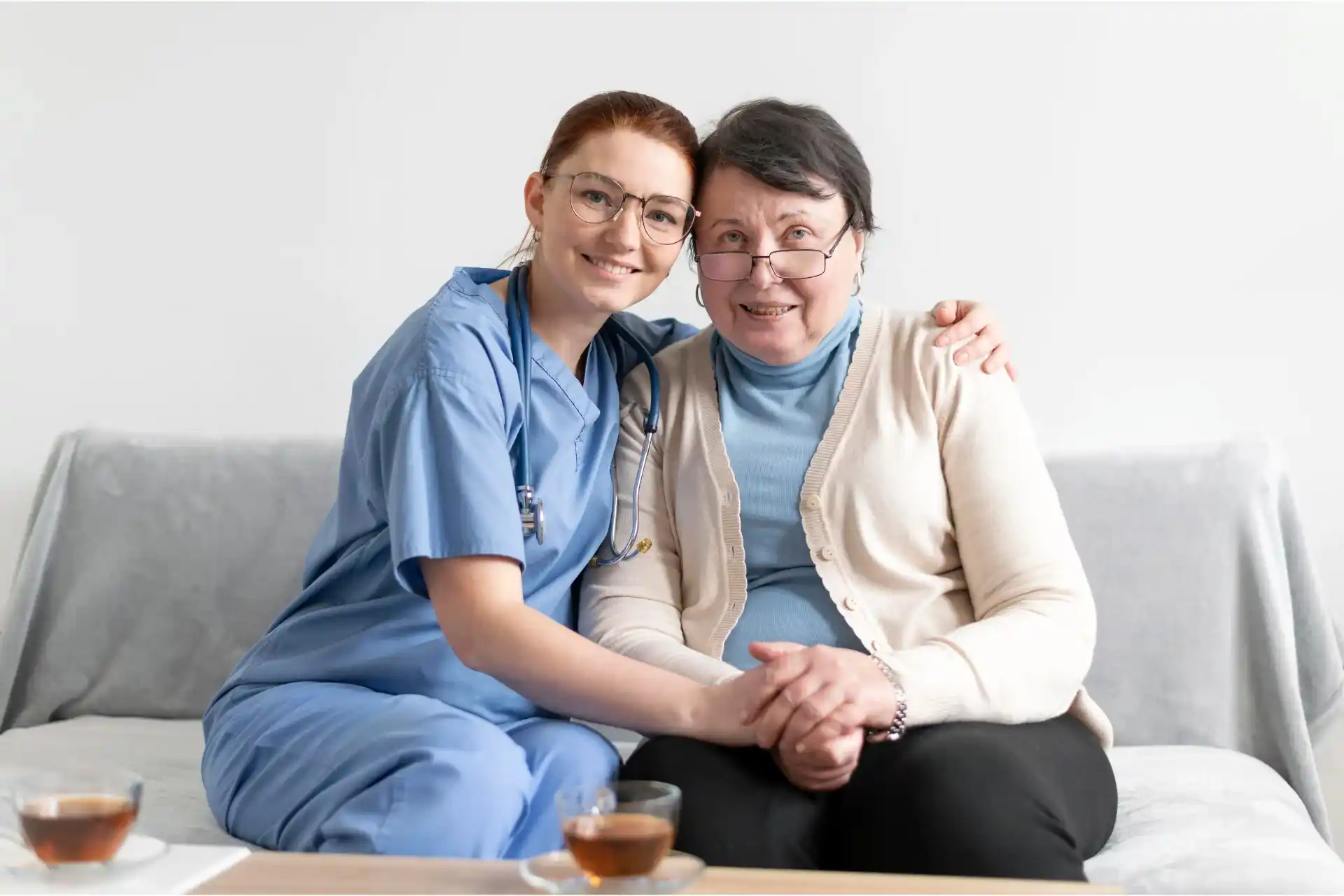 Senior lady with long-term care insurance plan and nurse at home