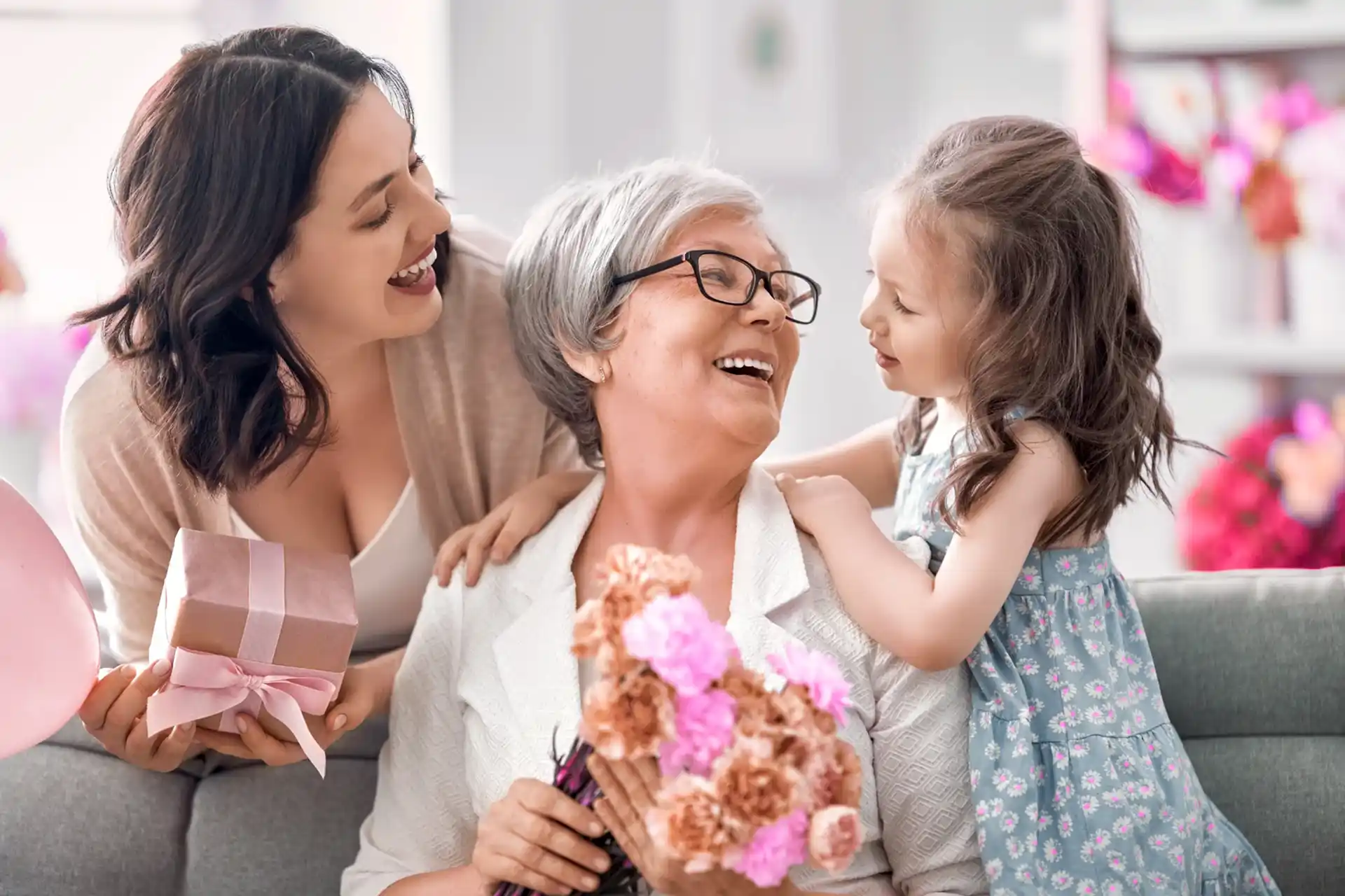 Little girl with smiling grandmother and mother