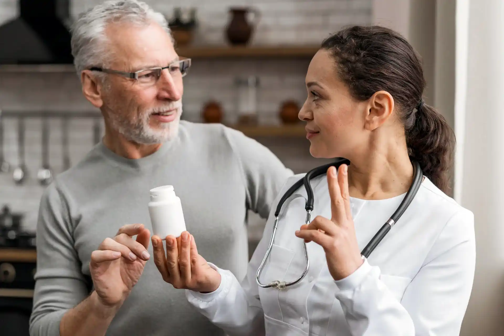 Lady nurse explaining benefits of prescription drugs plans to senior man